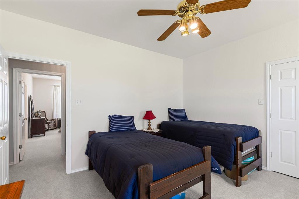 Bedroom featuring light-toned carpeting and neutral wall tones