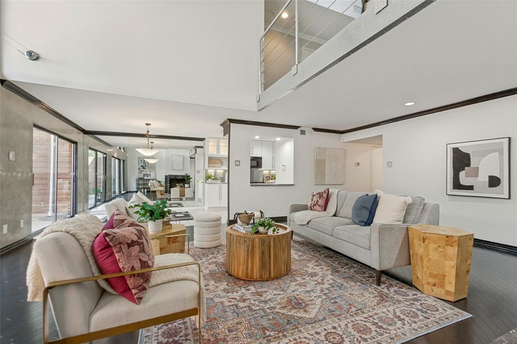 Vaulted ceilings, dark wood-finish flooring, recessed lighting, and gas starter fireplace