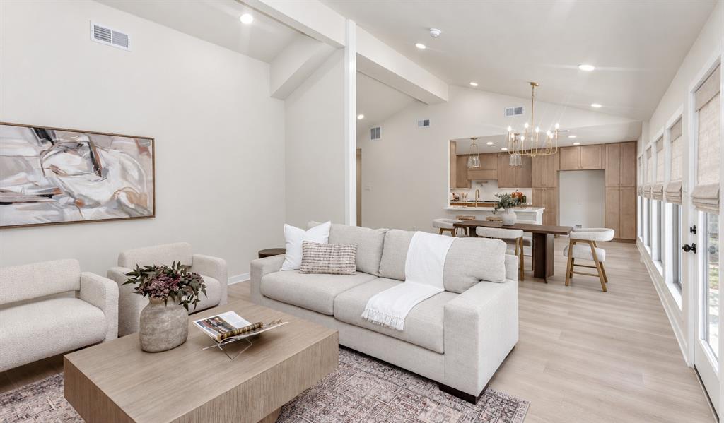 Vaulted ceilings with wall of windows, recessed lighting, wood-finish flooring, add to the contemporary look Vaulted ceilings with wall of windows, recessed lighting, wood-finish flooring, add to the contemporary look