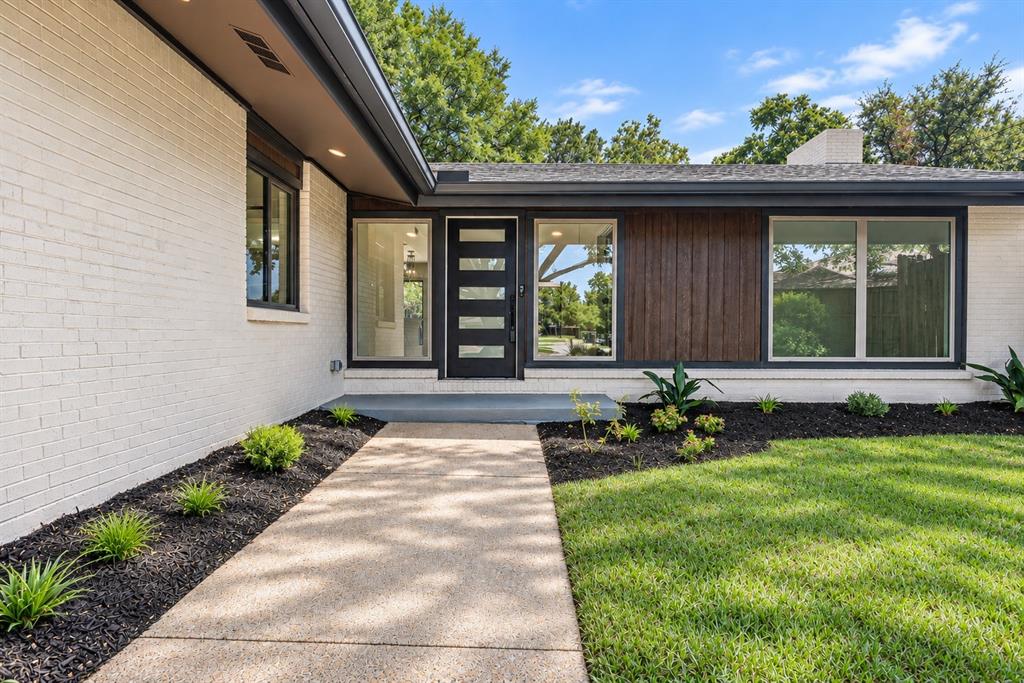 13924 Tanglewood PlaceWhitewashed brick exterior with dark wood paneling, a contemporary entry door, and large new windows enhance the entry 13924 Tanglewood PlaceWhitewashed brick exterior with dark wood paneling, a contemporary entry door, and large new windows enhance the entry