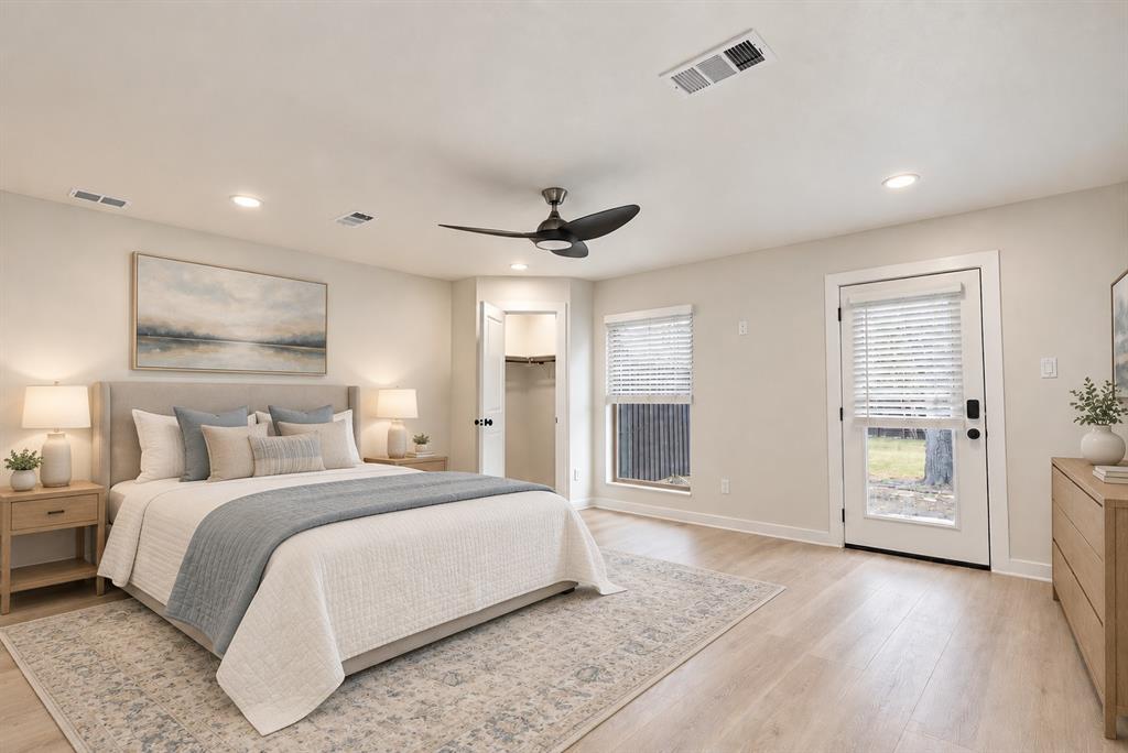 Bedroom 4 is oversized at 18x16. Recessed lighting, wood-finish flooring, ceiling fan, and a glass-paneled door to the backyard.