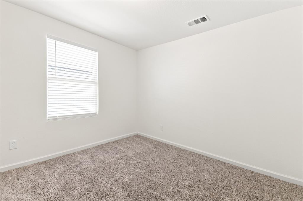 Neutral-toned wall-to-wall carpeting and crisp white walls Neutral-toned wall-to-wall carpeting and crisp white walls