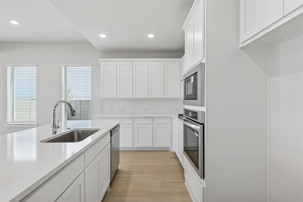 Kitchen in the Stanley II home plan by Trophy Signature Homes – REPRESENTATIVE PHOTO