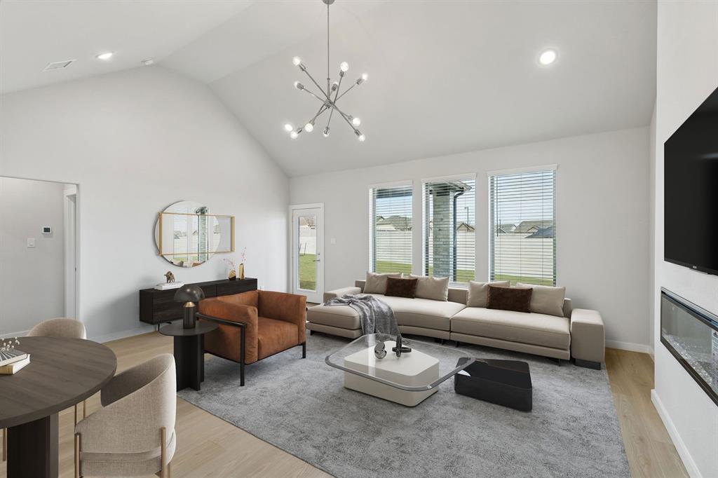 Dining and Living Room in the Stanley II home plan by Trophy Signature Homes – REPRESENTATIVE PHO