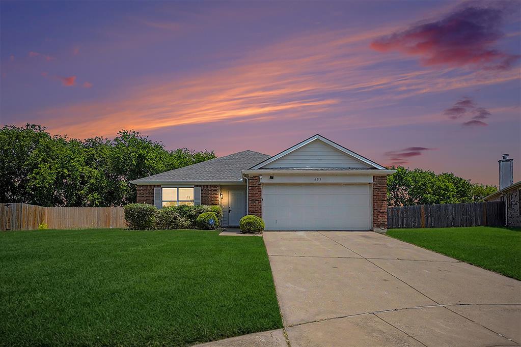 Charming single-story brick home with a two-car garage and manicured lawn Charming single-story brick home with a two-car garage and manicured lawn