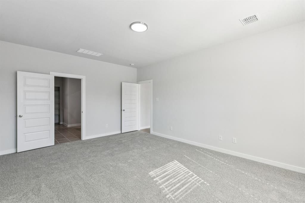 Primary Suite in the Winters home plan by Trophy Signature Homes – REPRESENTATIVE PHOTO