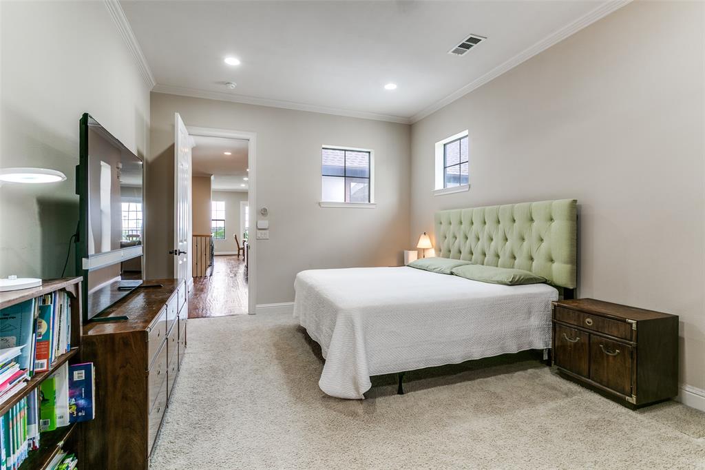 Spacious primary bedroom offering a comfortable and relaxing retreat at the end of the day.