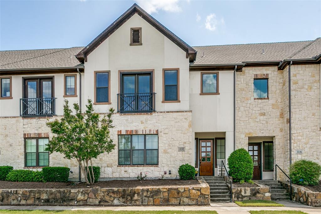 Front exterior showcasing the home’s stone exterior and inviting curb appeal.