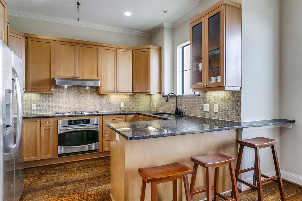 Open kitchen featuring a sink with a window view, creating a bright and open feel.