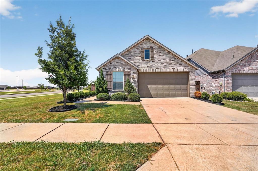 Stone and brick facade with a two-car garage