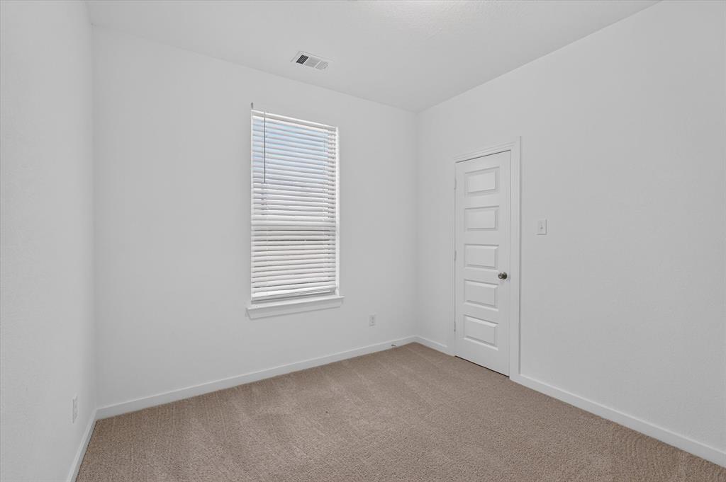 Neutral-toned carpeting complements the light wall finishes