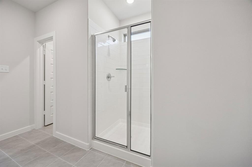 Primary Bathroom in the Oak II home plan by Trophy Signature Homes – REPRESENTATIVE PHOTO