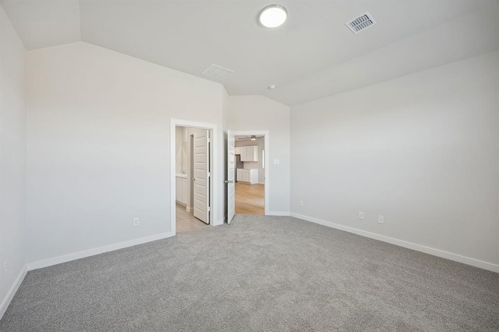 Primary Suite in the Oak II home plan by Trophy Signature Homes – REPRESENTATIVE PHOTO