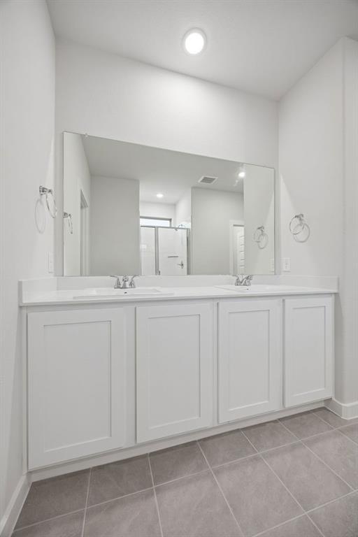 Primary Bathroom in the Oak II home plan by Trophy Signature Homes – REPRESENTATIVE PHOTO