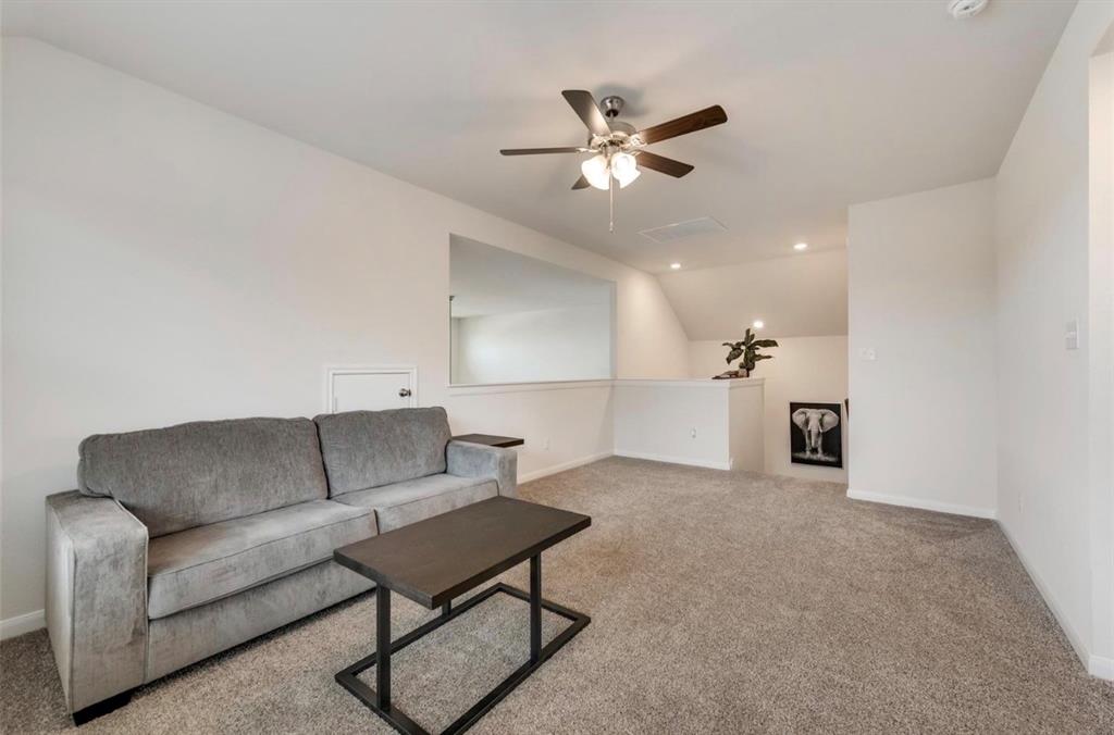 Versatile bonus room featuring soft carpeting, a ceiling fan with integrated lighting, and recessed lighting