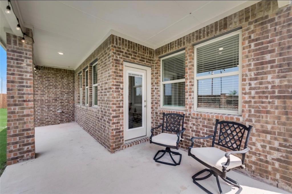 Covered outdoor patio featuring a concrete surface, recessed lighting, and string lights