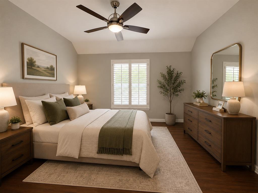 Vaulted ceiling room featuring warm wood-finish flooring