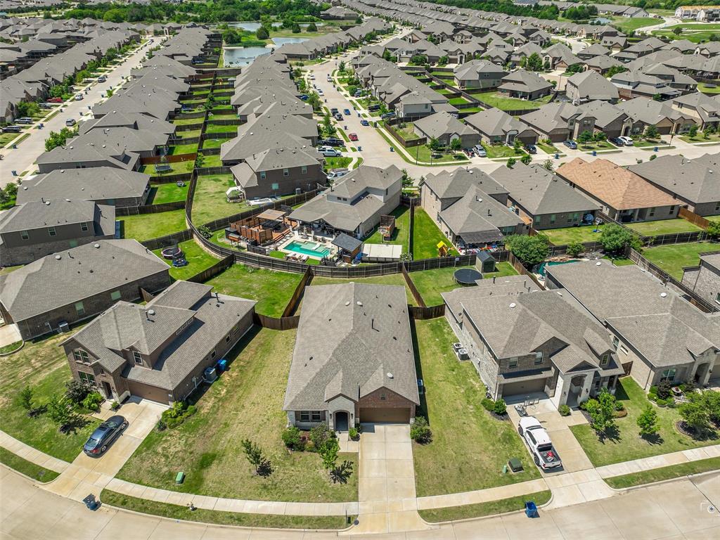 Aerial view showcasing a residential neighborhood with a consistent architectural style