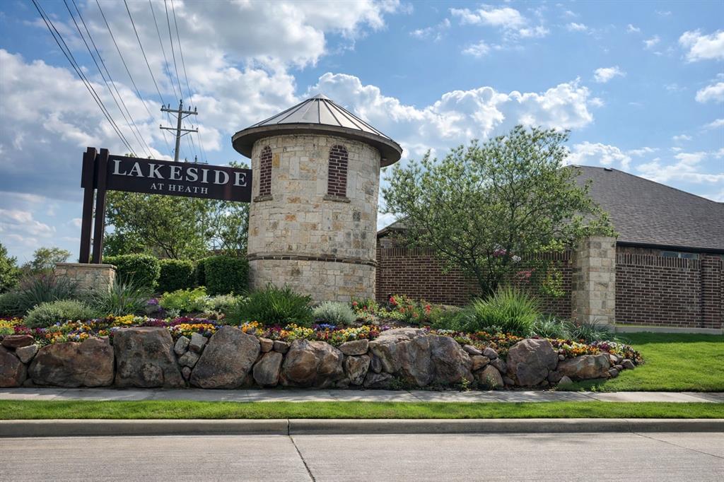 Stone and brick entry monument featuring a turret-style architectural element Stone and brick entry monument featuring a turret-style architectural element