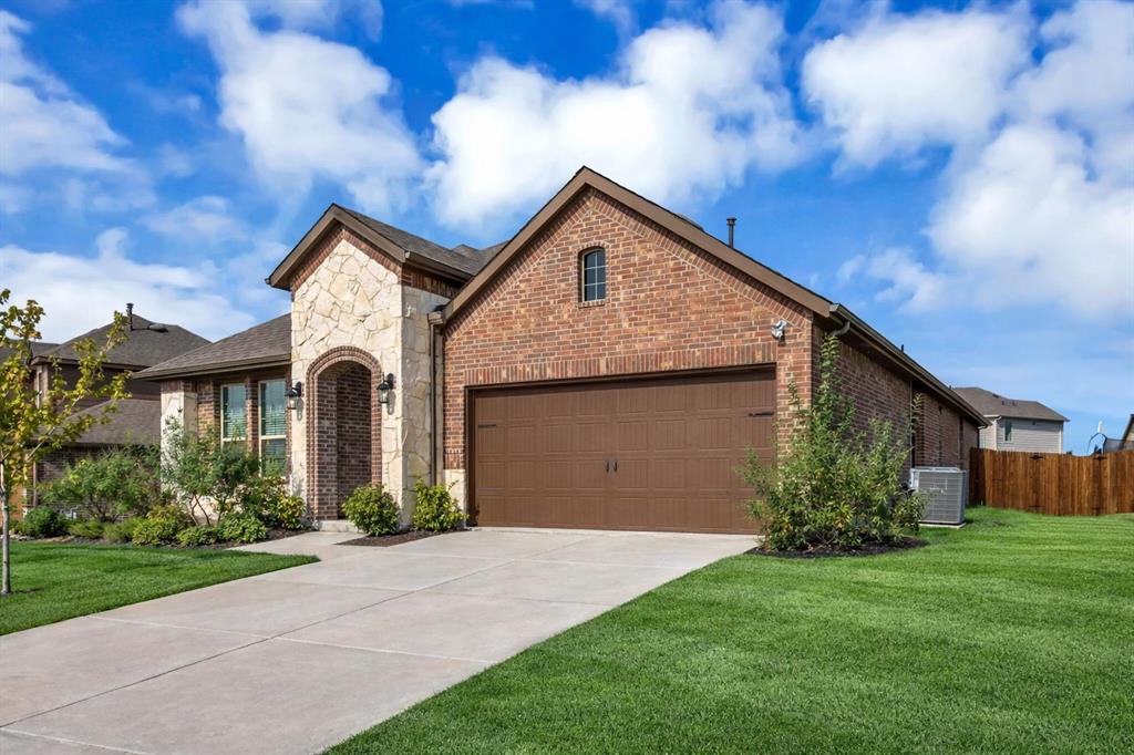 Brick and stone exterior featuring an arched entryway Brick and stone exterior featuring an arched entryway