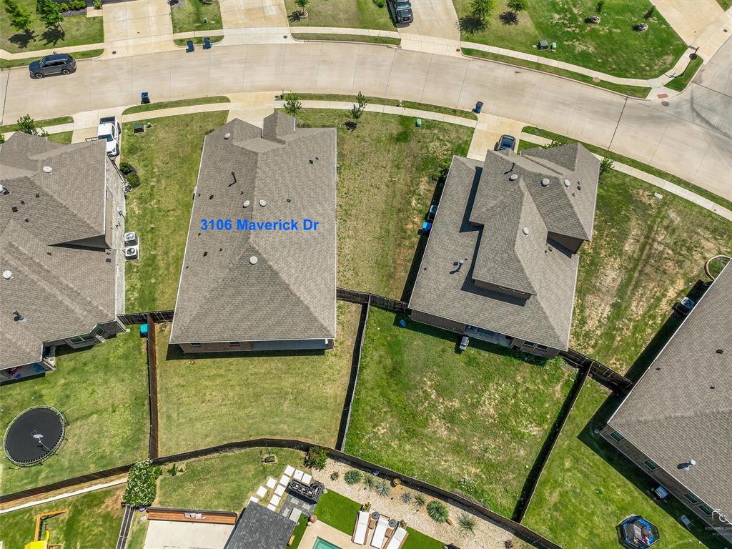 Single-story residence with a gray shingle roof and a private fenced backyard