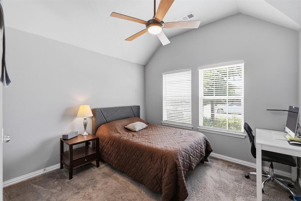 One of the four additional bedrooms, located in the front of the home