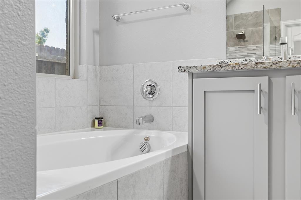 Soaking tub in primary bathroom