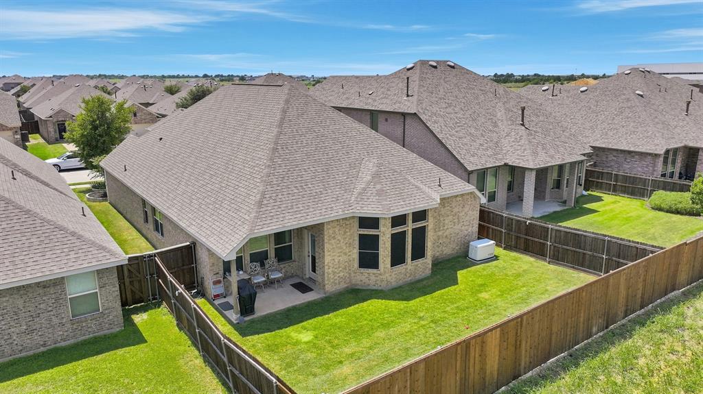 Aerial view of the backyard and home