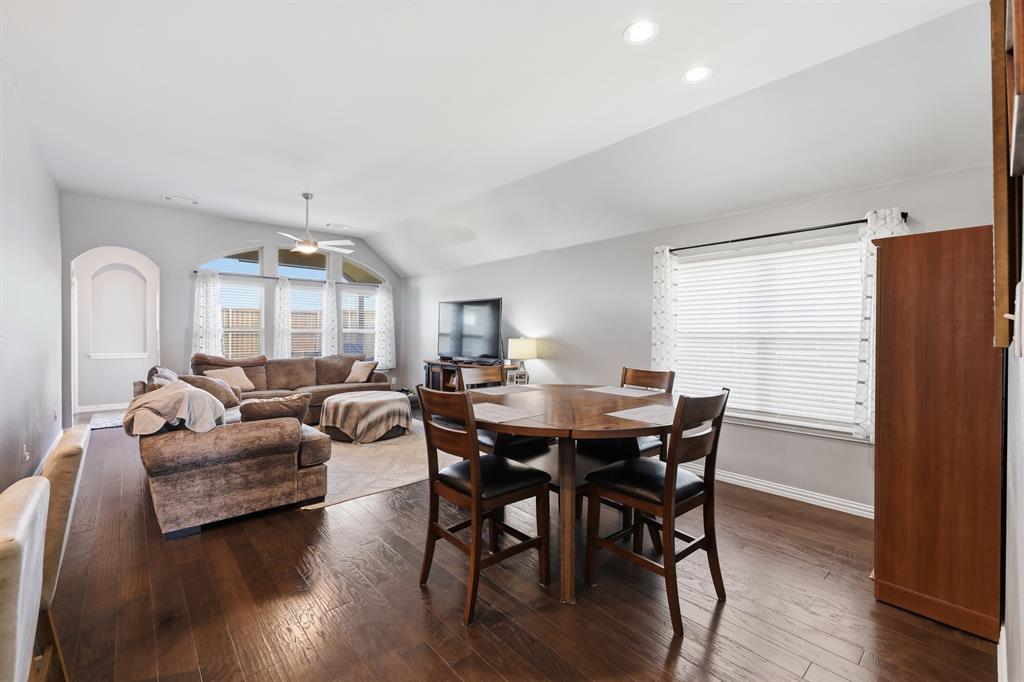 Open-concept showcasing the dining room and living room