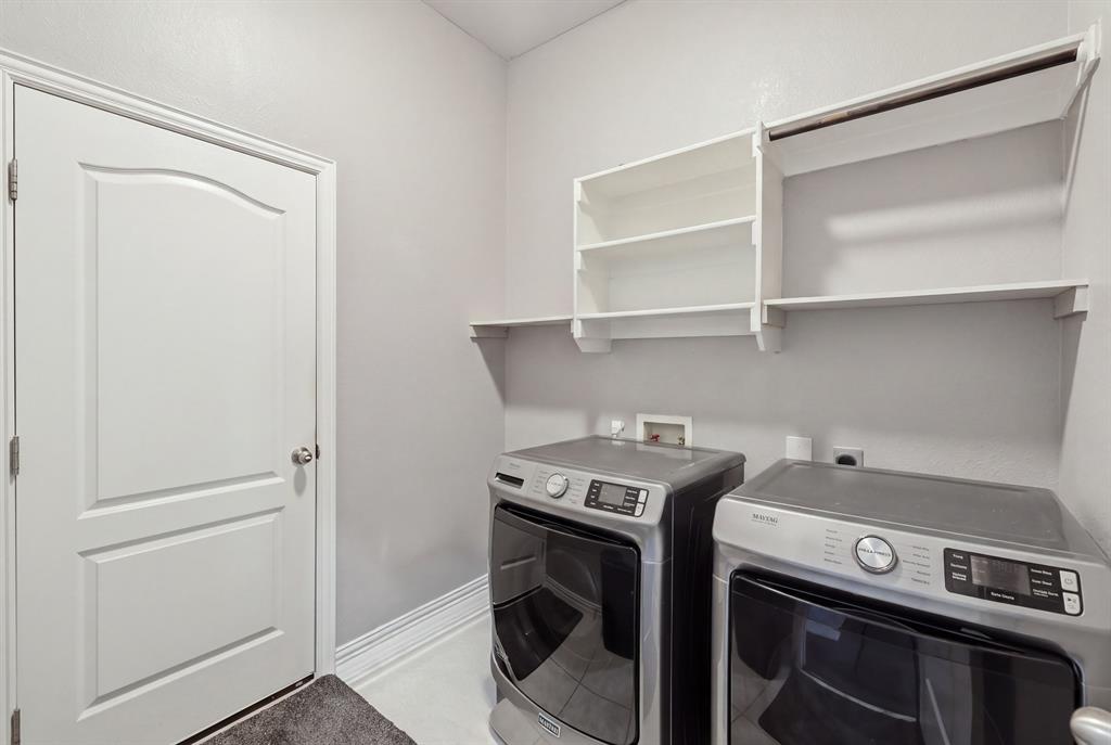 Large laundry room located off the garage entry