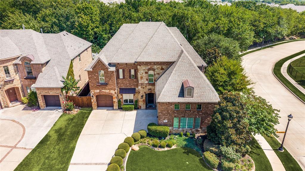 This image highlights the privacy afforded by the mature trees and the expansive nature of the corner lot.