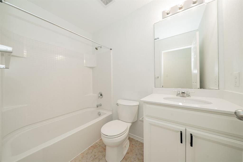 Full bathroom featuring vanity,  shower combination, and tile patterned flooring