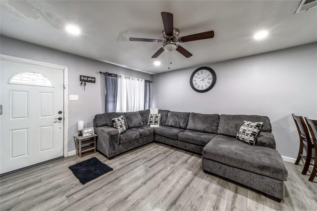 Living area featuring recessed lighting, light wood-style flooring, and a ceiling fan
