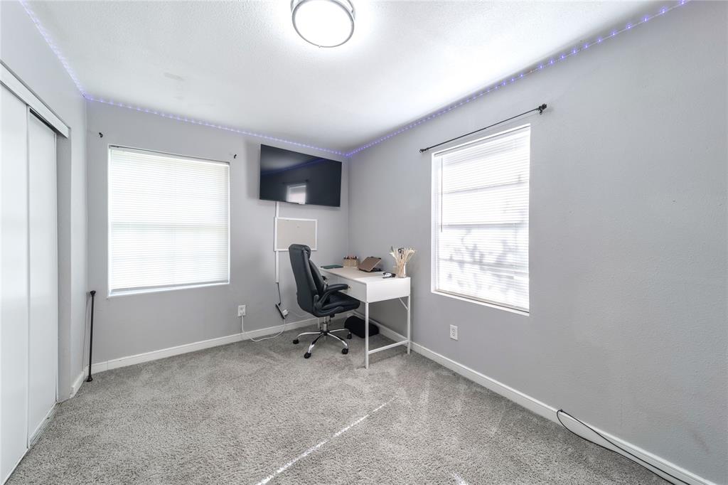 Office space with carpet and plenty of natural light