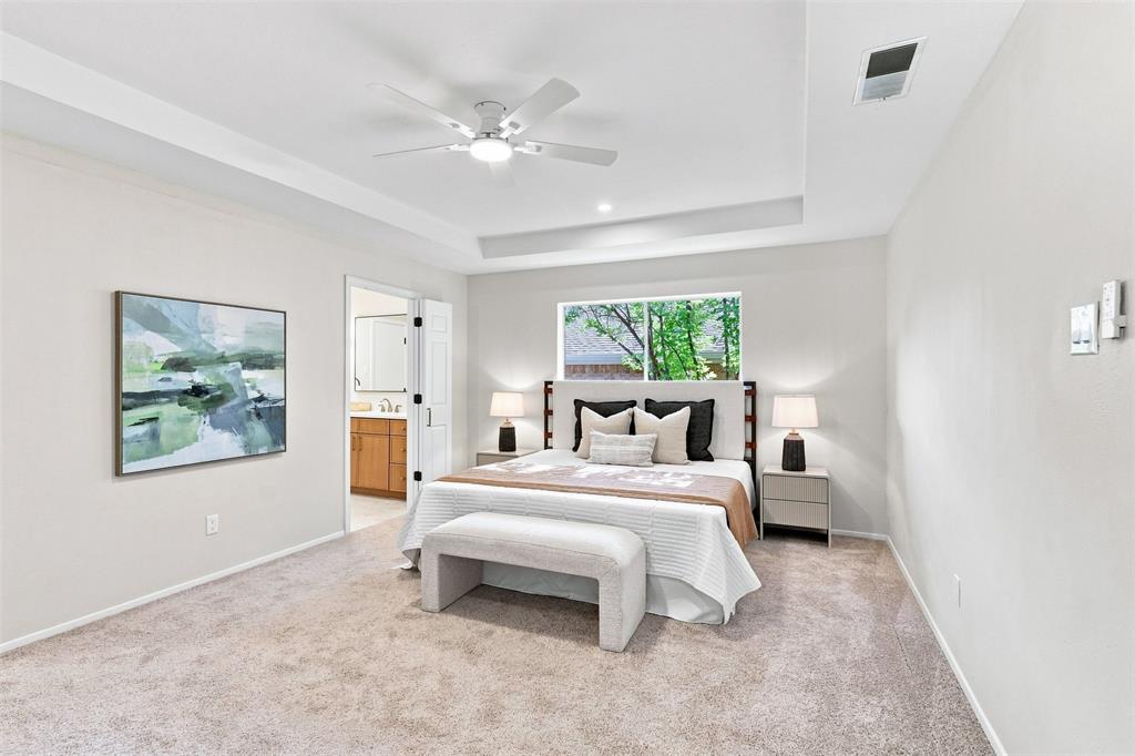 Tray ceiling with recessed lighting and a ceiling fan