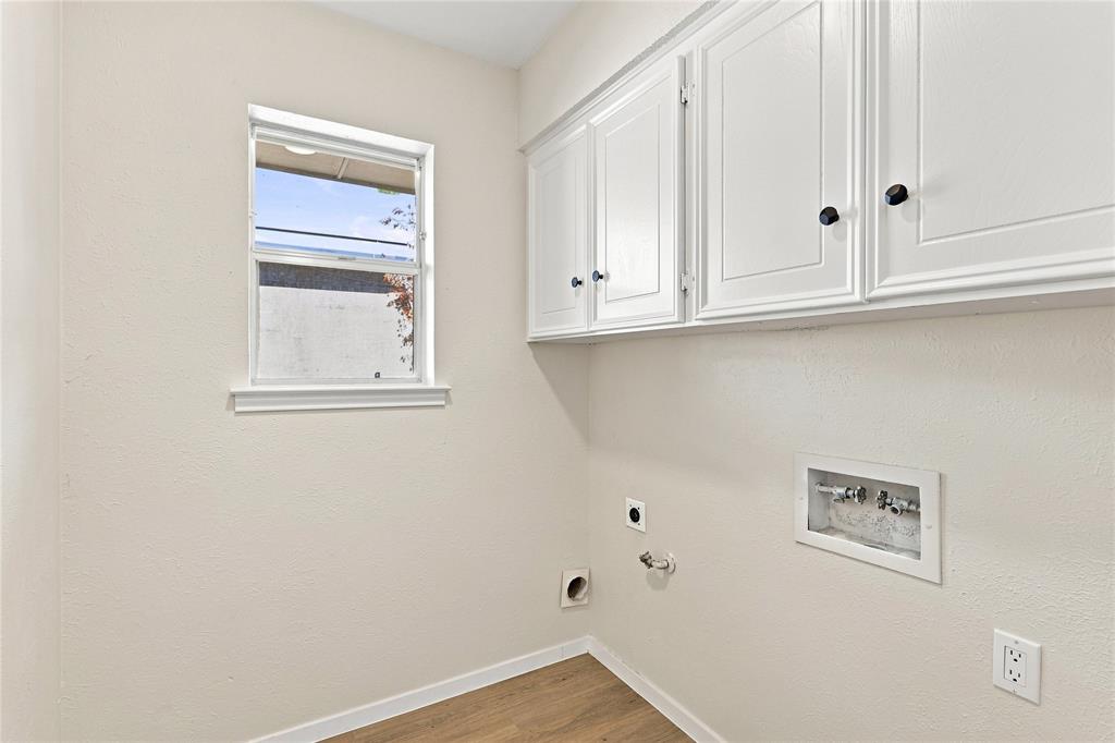 White shaker-style cabinetry with black hardware