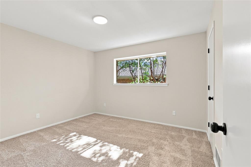 Neutral-toned walls with plush carpeting