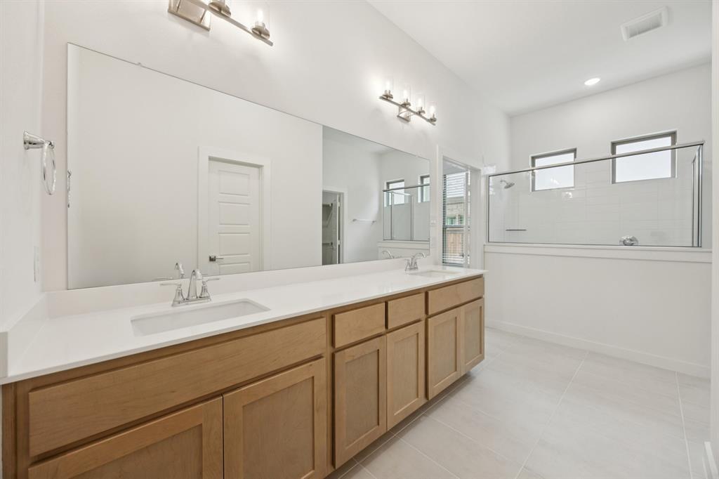 Primary Bathroom in the Monet II home plan by Trophy Signature Homes – REPRESENTATIVE PHOTO