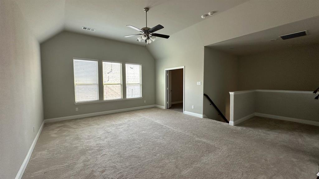 Tiled flooring, white baseboards, and a built-in hanging rod