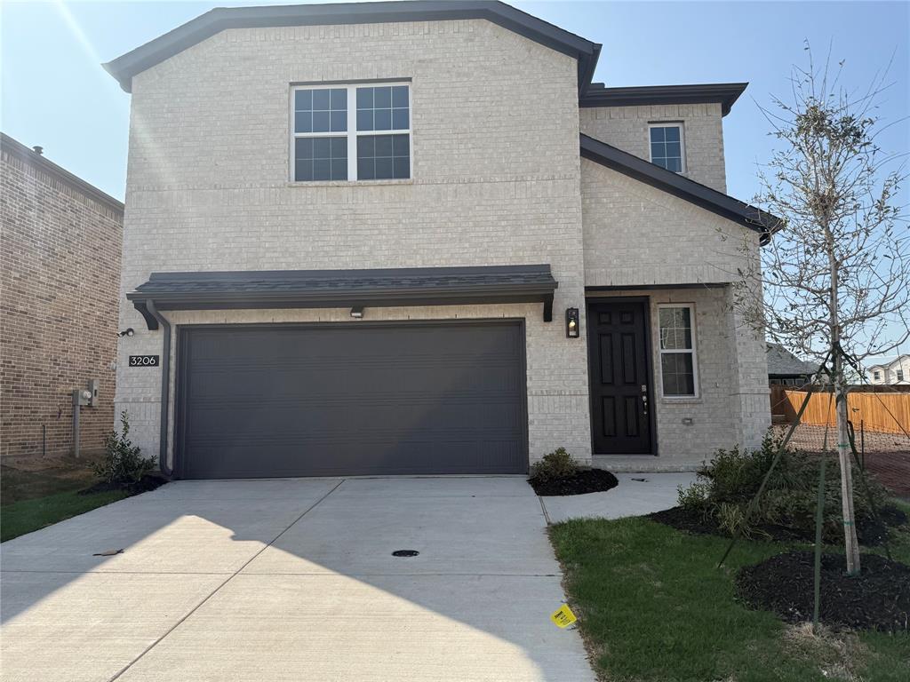 Brick exterior with dark trim and black garage door Brick exterior with dark trim and black garage door