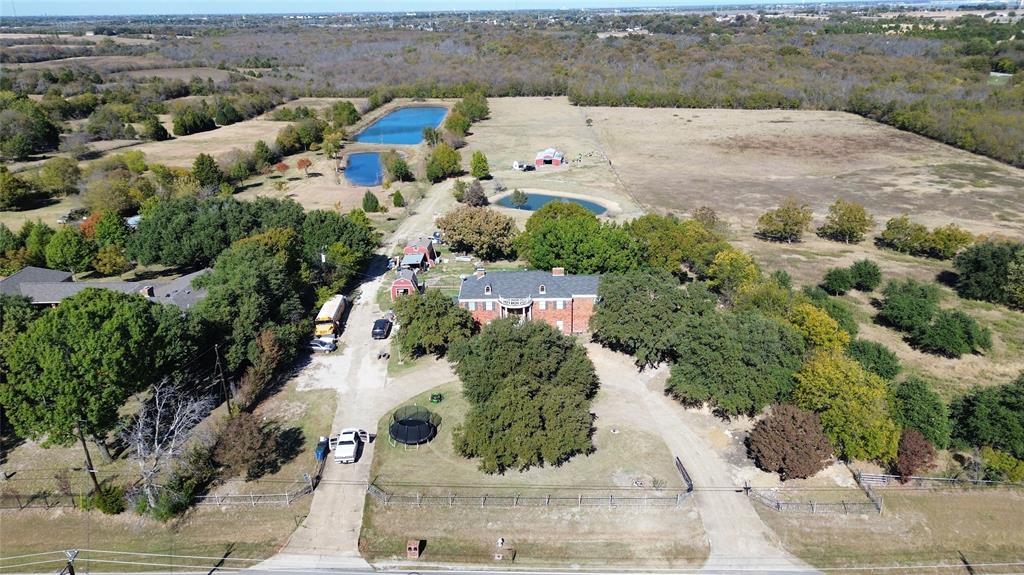 Aerial view of property's location with a nearby body of water
