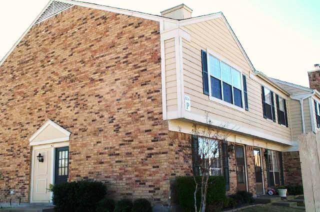 Another view of the front of the unit. Brick and siding exterior with gabled roofline and multiple window treatments Another view of the front of the unit. Brick and siding exterior with gabled roofline and multiple window treatments