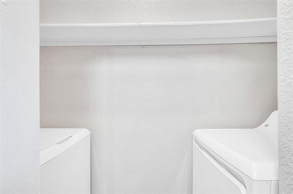 utility room with full size washer and dryer