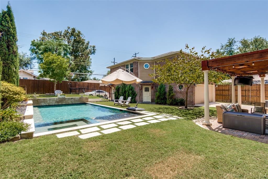 Rectangular in-ground pool with surrounding stone coping