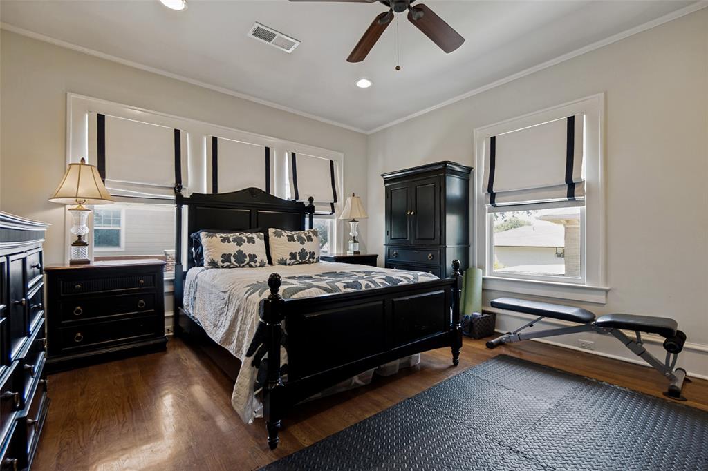 Hardwood flooring, recessed lighting, ceiling fan, and multiple windows with trim