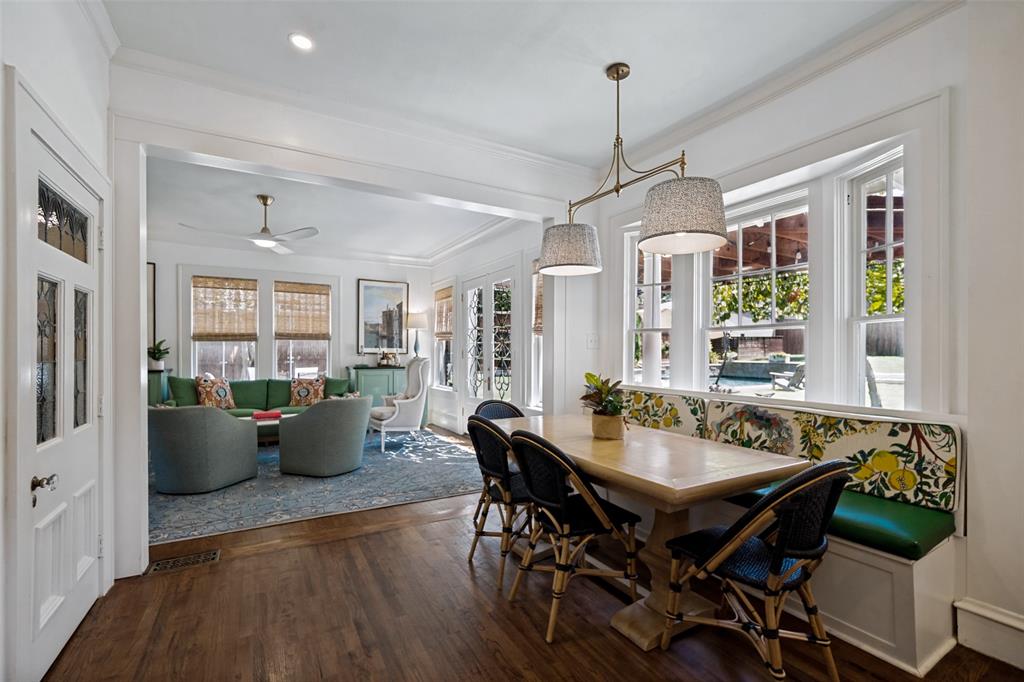 Hardwood-finish flooring, built-in window seating, decorative pendant lighting, and an open-concept layout