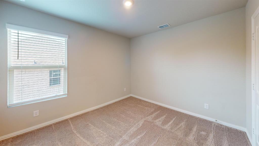 Window with horizontal blinds, neutral wall paint, and plush carpet flooring