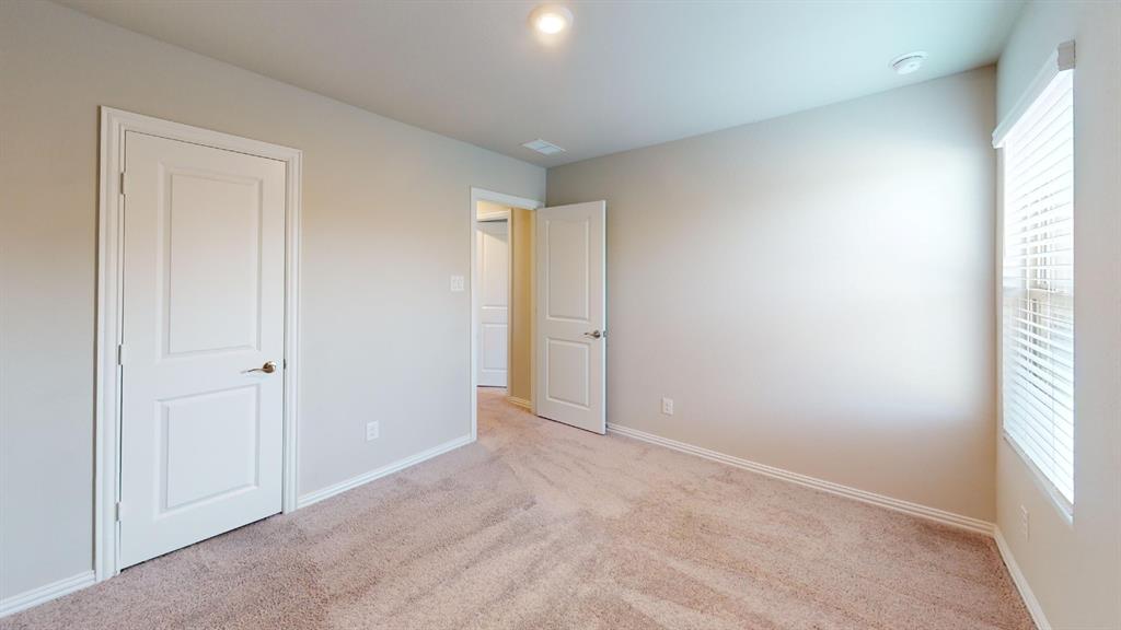 Neutral-toned carpeting paired with light-colored wall paint