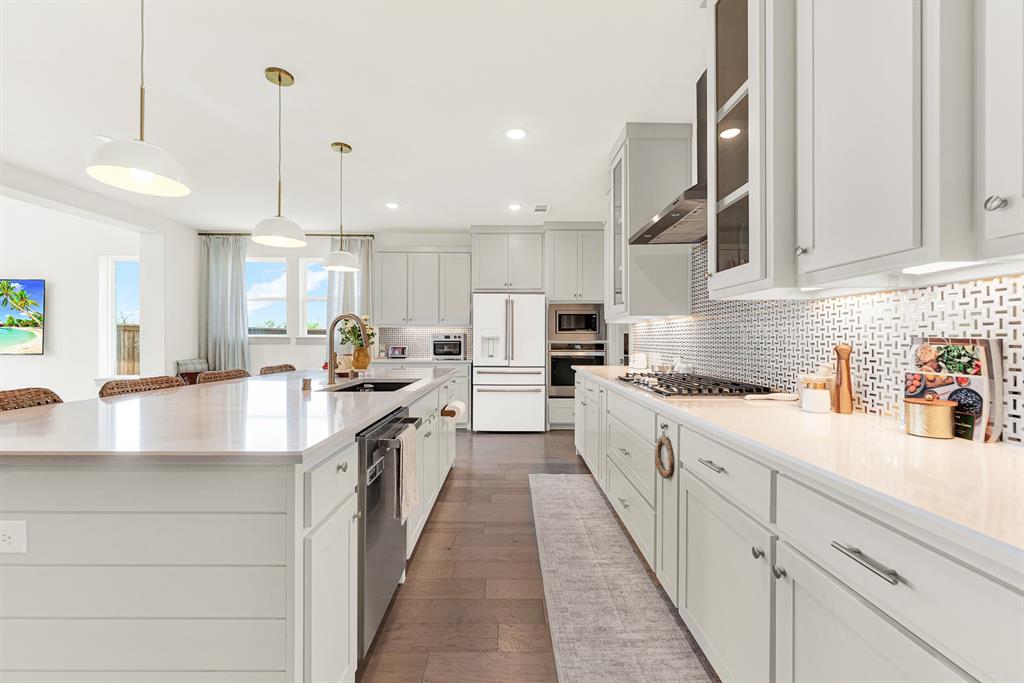 A polished geometric backsplash catches soft under-cabinet glow beside custom shaker cabinetry. It’s ideal for chatting over evening wine while pasta simmers nearby. A polished geometric backsplash catches soft under-cabinet glow beside custom shaker cabinetry. It’s ideal for chatting over evening wine while pasta simmers nearby.