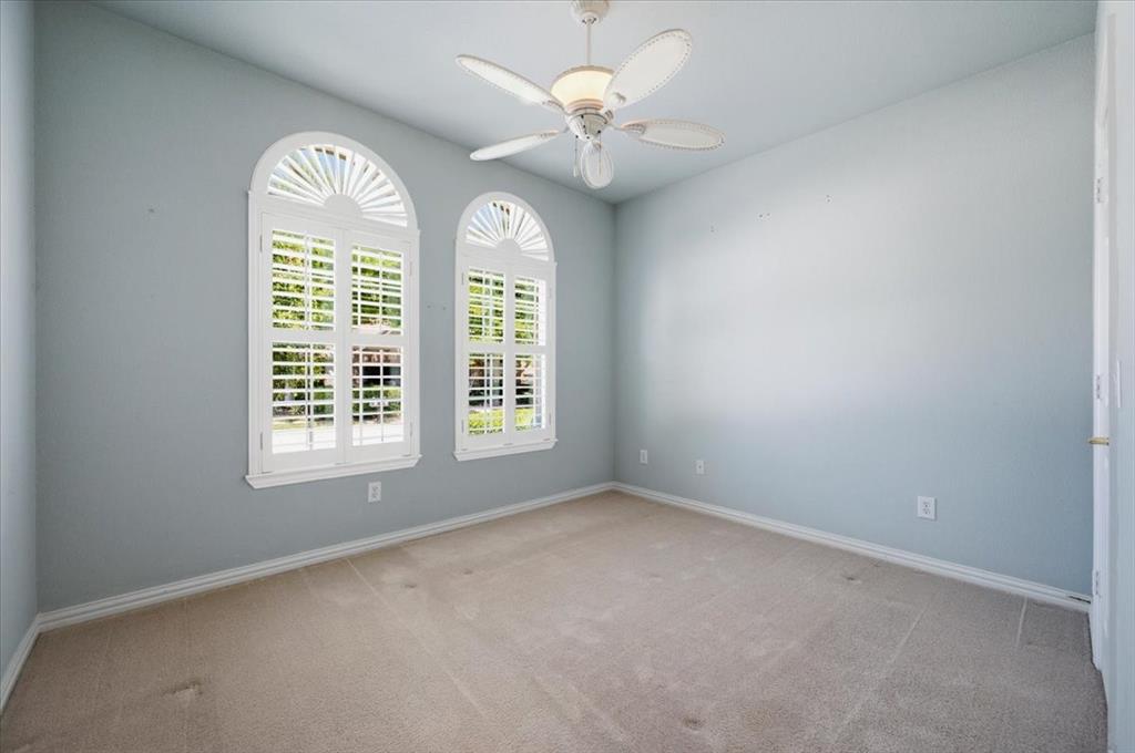 Front bedroom with shutters - full bath adjacent - as guest bath - picture before new paint color